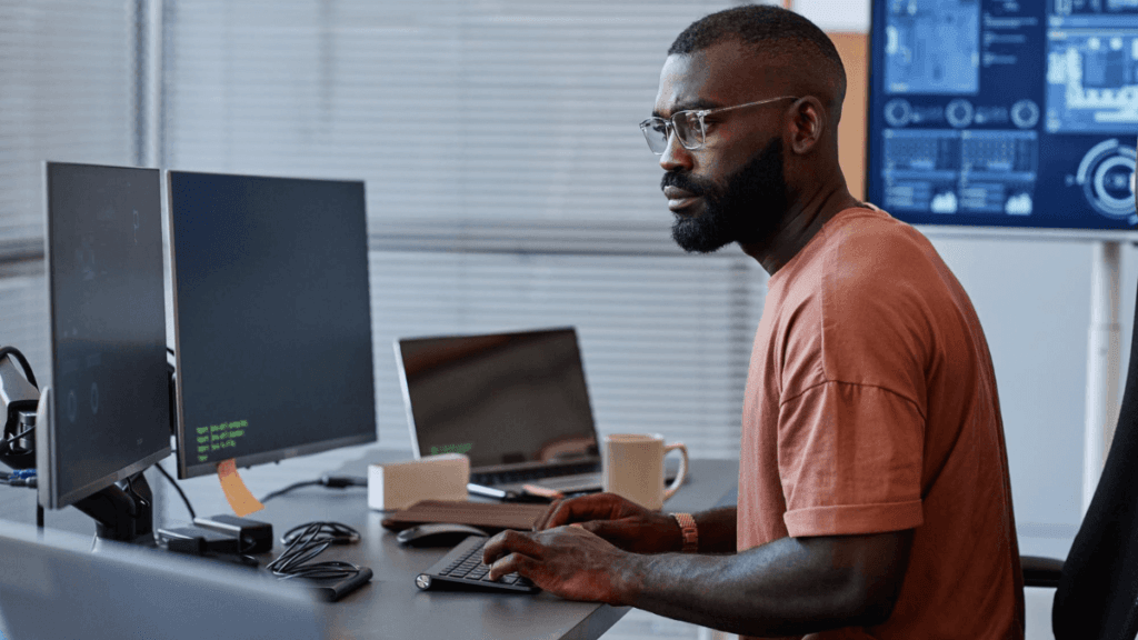 ICT Security Administrator working on computer systems
