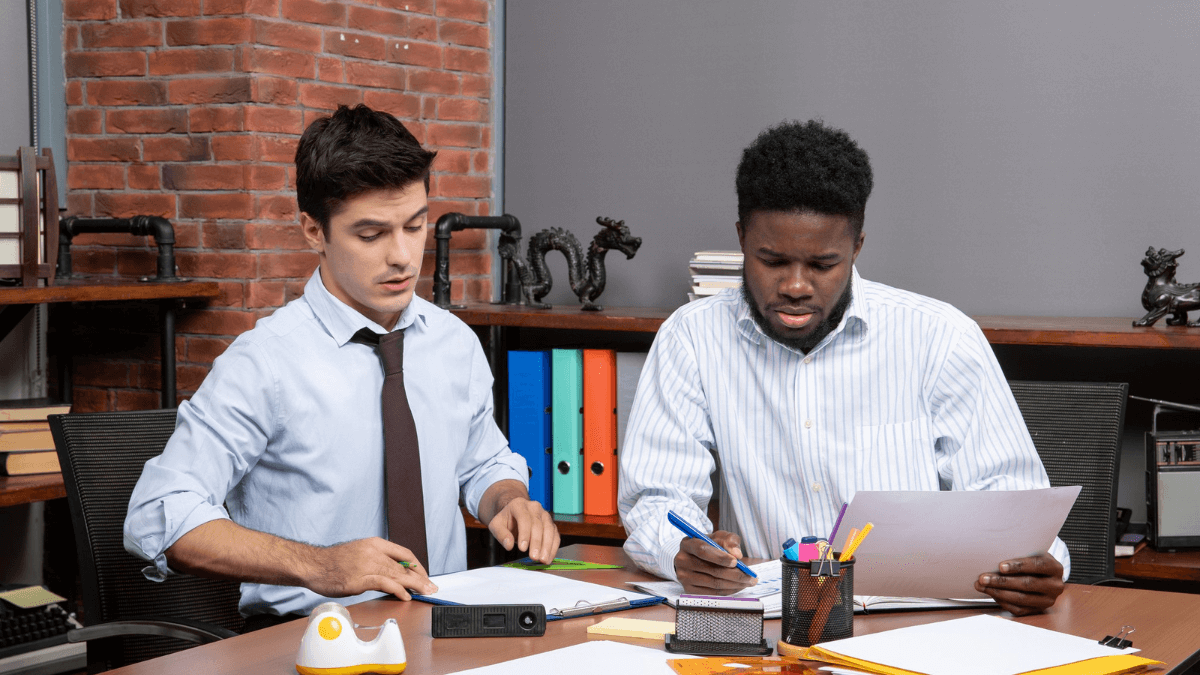 Tutor explaining accounting principles in a hybrid classroom setting